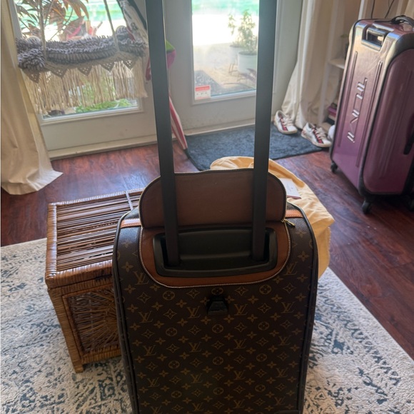 Louis Vuitton canvas rolling duffle bag, gently used. - Picture 13 of 14